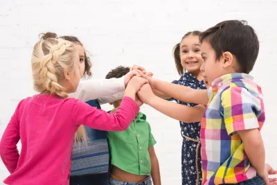 Cooperative Play for Social Development